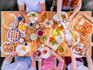 a table with five people seated having dinner