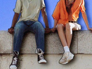 a couple sitting on a curb asking questions for couples