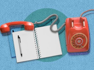 Red telephone and open notebook